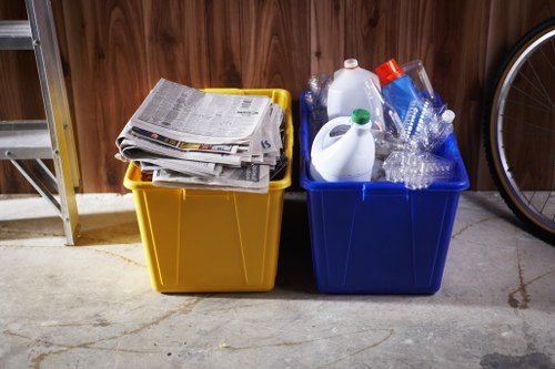 Technician performing a site risk assessment near waste containers